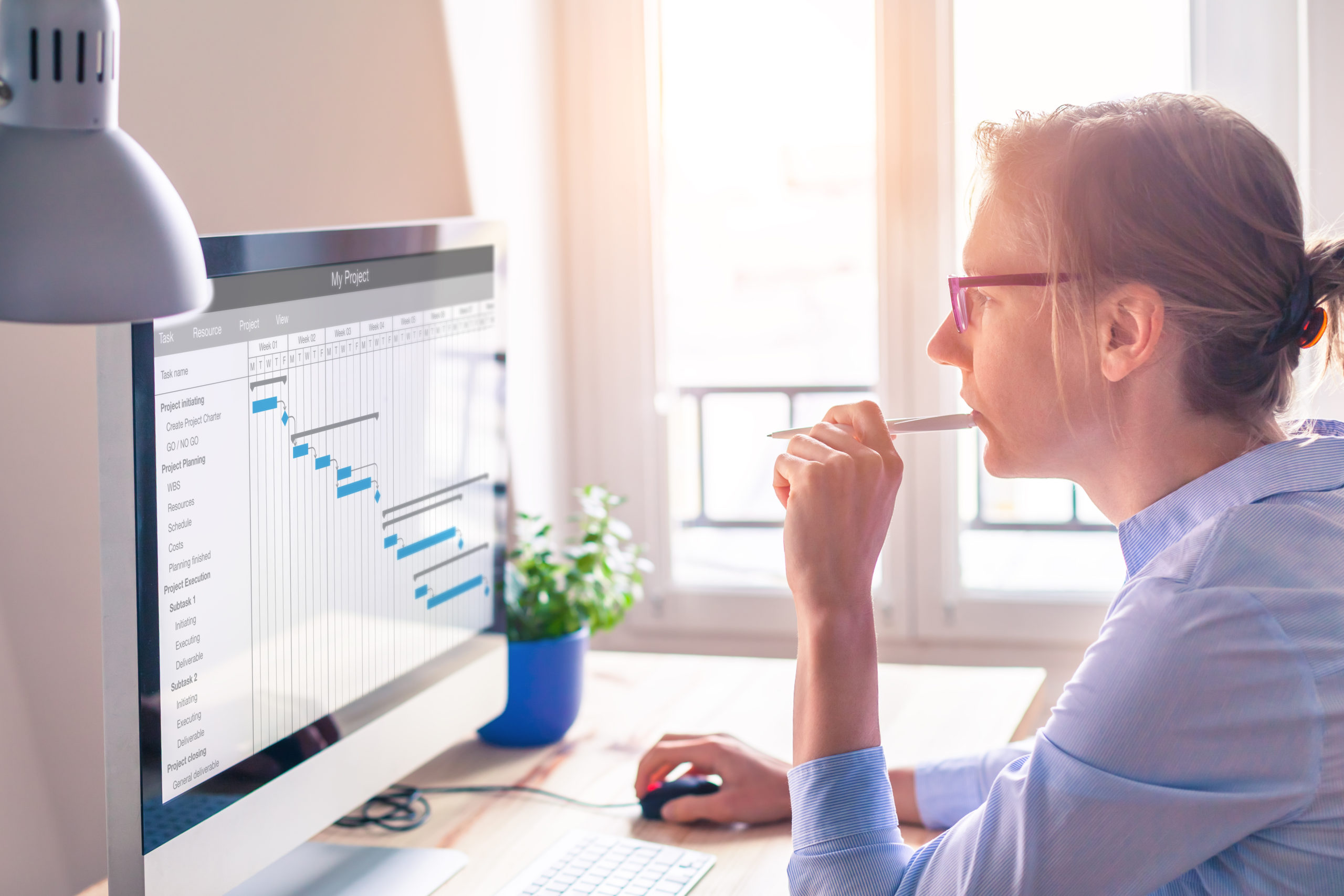 Project manager using Gantt chart, tasks planning and scheduling, computer